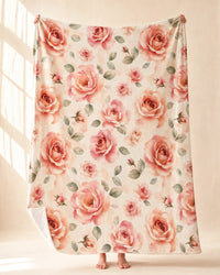 Laila's Garden Blanket held open full length, showing the whole watercolor rose print and the soft white reverse at the turned corner