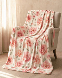The blanket draped over a linen armchair in warm morning light, falling to the floor