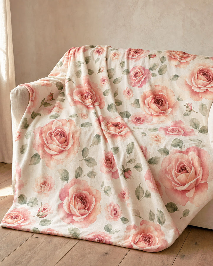The blanket spread open across the corner of a cream sofa, showing how much of the seat it covers