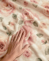 A hand resting on the blanket, showing that each open rose is larger than an open hand