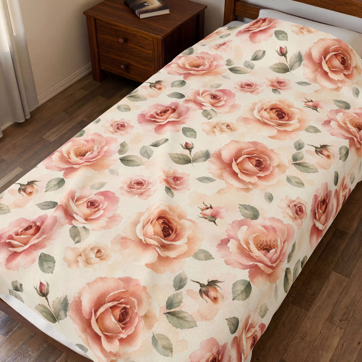 The blanket spread across a bed beside a wooden nightstand in a warm bedroom