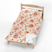 The blanket folded over a wooden bed frame, showing its full length