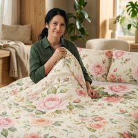 Vintage rose floral cotton duvet cover and matching sham set on a bed