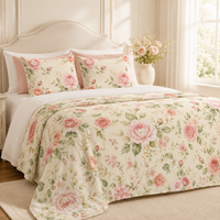 Rose floral duvet cover and matching pillow shams in a cozy bedroom