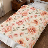 The blanket draped over the corner of a bed in a sunlit bedroom