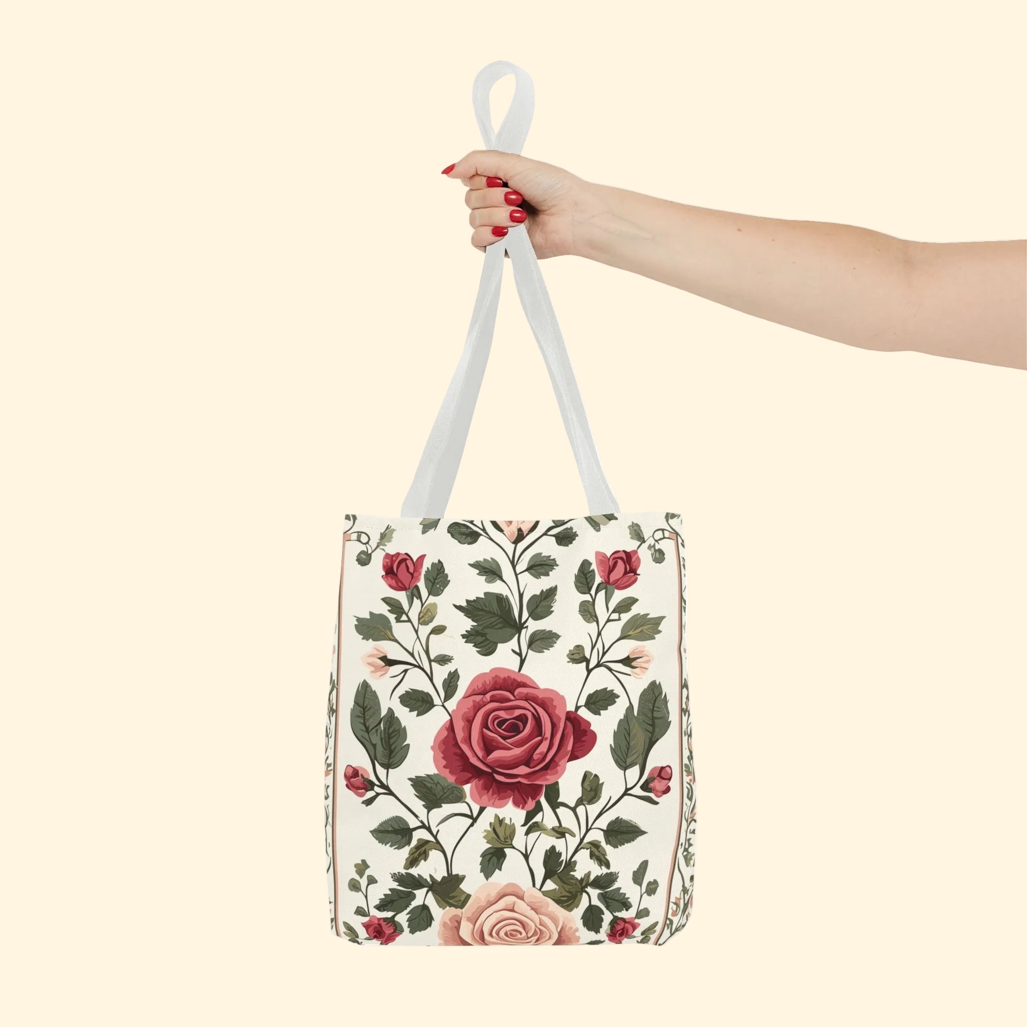 Floral-patterned bag held by a hand on a white background