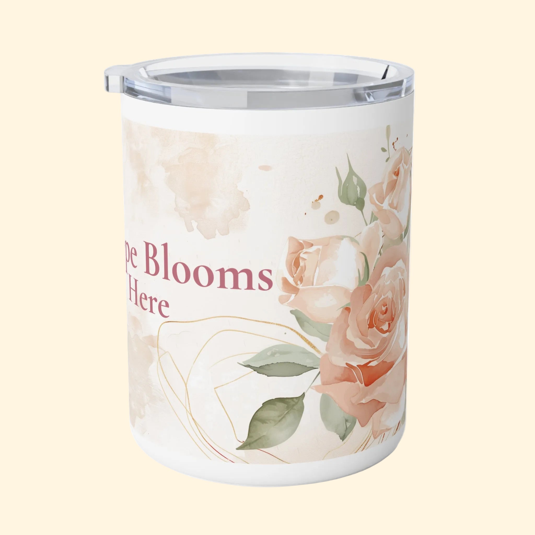 Tumbler with floral design and text 'The Blooms Are Here' on a white background
