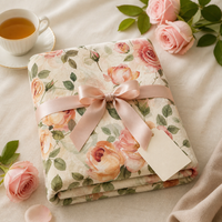 Laila's Garden rose blanket in lifestyle setting — cozy velveteen throw with blush watercolor design